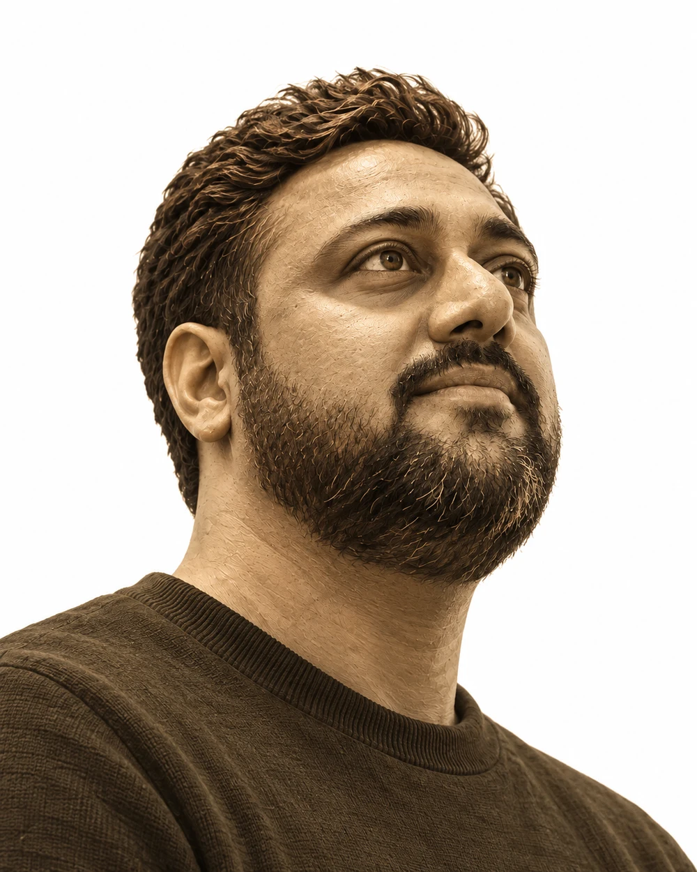 A sculptural sepia portrait inspired by Prasanna’s reference, looking upward as ideas orbit around him