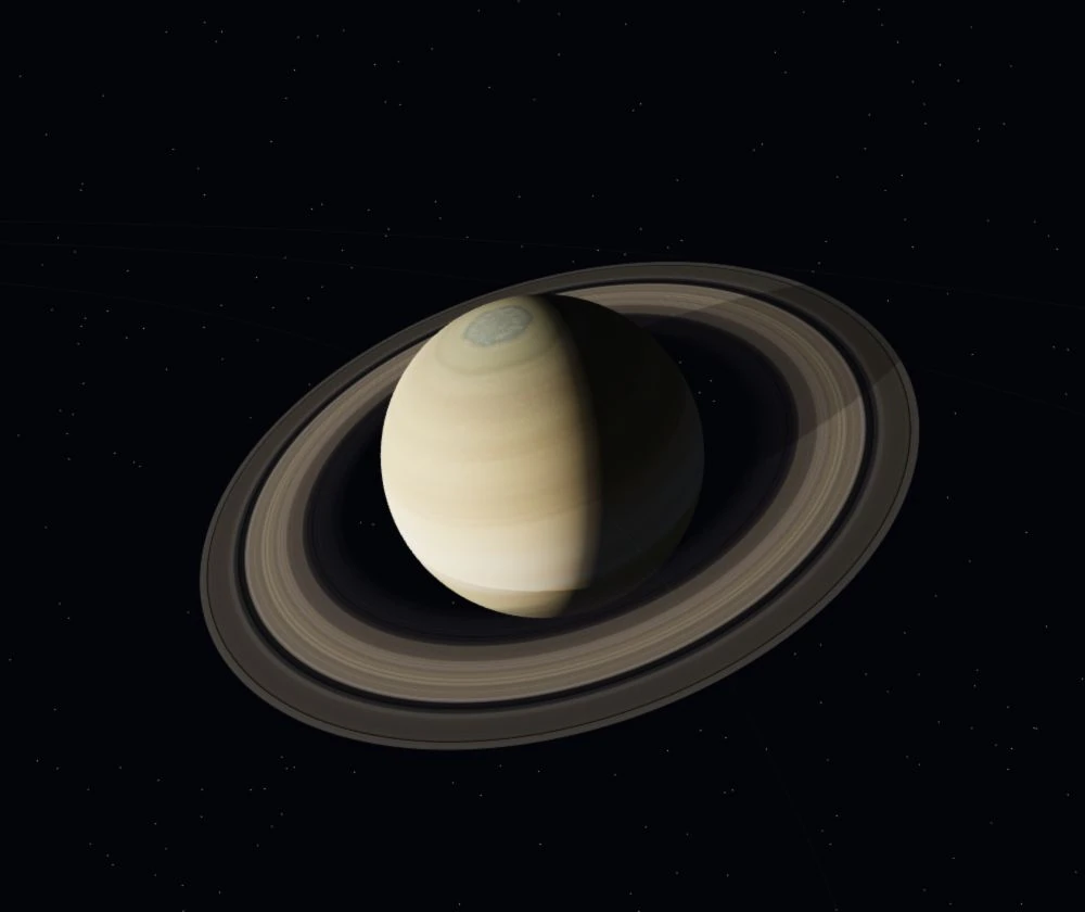 Saturn’s textured globe and intricate rings against a field of stars